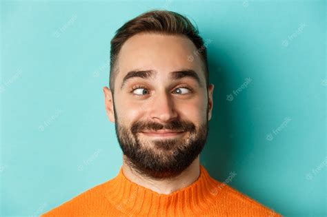 Premium Photo Headshot Of Funny Caucasian Man Making Faces Squinting