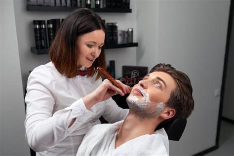 The Barber Woman Shaves Beard With Razor Stock Photo Image Of Leisure