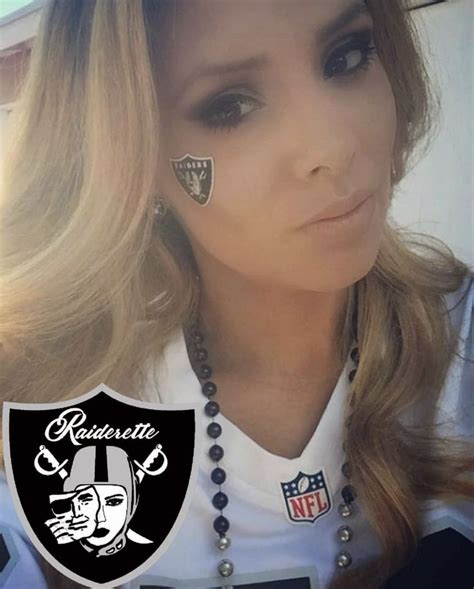 A Woman With Some Piercings On Her Face And An Oakland Football Logo