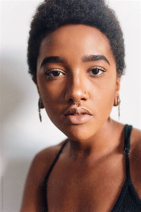Portraits Of A Beautiful Young Black Woman Against A White Wall Del