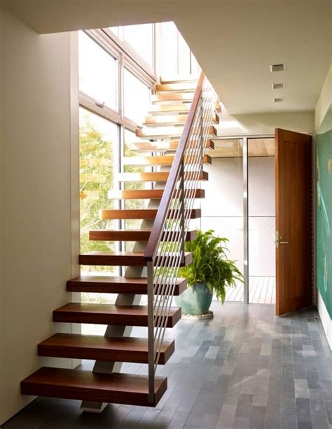 You can ask a professional wood carving to make some ornaments on your wooden staircase. Latest modern stairs designs ideas catalog 2018
