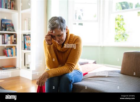 Mature Woman Alone At Home Stock Photo Alamy