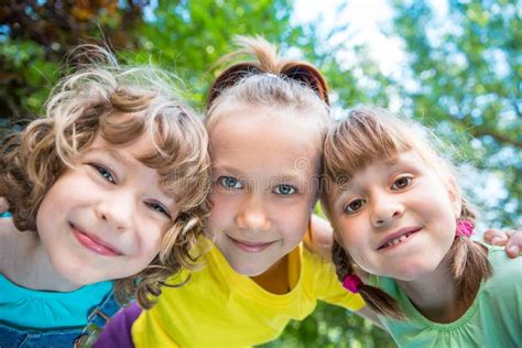 Group Of Happy Children Playing Outdoors Stock Image Image Of