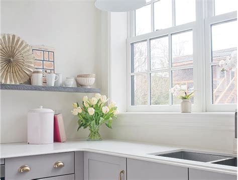 It works great on kitchen cabinets that have a lot of natural light. soft gray lower cabinets | Yellow kitchen walls, Grey kitchen walls, Grey yellow kitchen