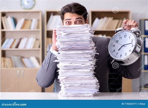 Businessman Struggling To Meet Challenging Deadlines Stock Image