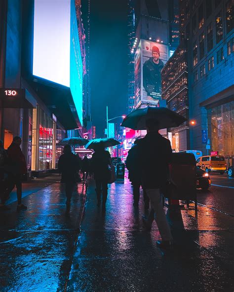 People Walking On Street During Night Time Photo Free City Image On