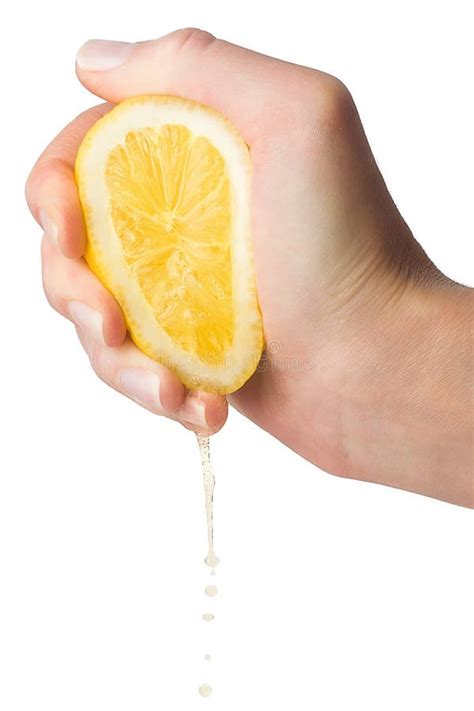 Hand Squeezes Lemon Juice On A White Background Stock Photo Image Of