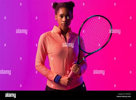 Image Of African American Female Tennis Player With Racket In Neon Pink
