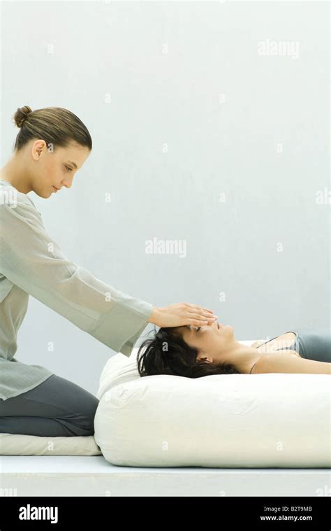 Woman Receiving Reiki Head Massage Stock Photo Alamy