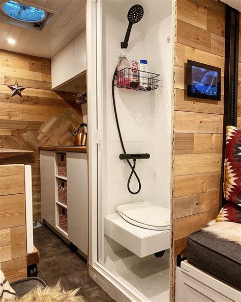 Camper Van Bathroom Setup With Indoor Shower And Floating Toilet By
