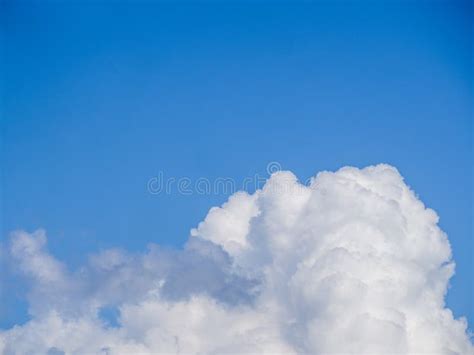 A Big Fluffy White Cloud On A Clear Azure Blue Sky Stock Image Image