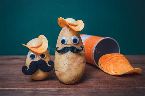 Funny Potato Head With Face On Wooden Table Stock Photo Image Of