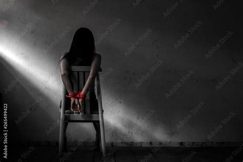 Young Woman Sitting On Chair And Tied Up With Rope Victim Woman Tied