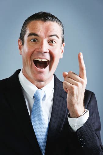 Handsome Smiling Businessman Has A Very Bright Idea Stock Photo