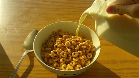 Pouring Milk Into Cereal