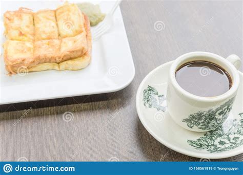 Perkataan kopitiam merupakan gabungan perkataan kopi dari bahasa. Delicious Kaya Toast With Jam And Kopitiam Coffee Mug In ...