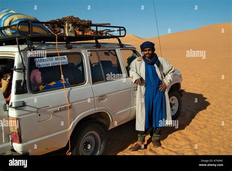 Tuareg Man And His Land Cruiser Sahara Desert Libya Stock Photo Alamy