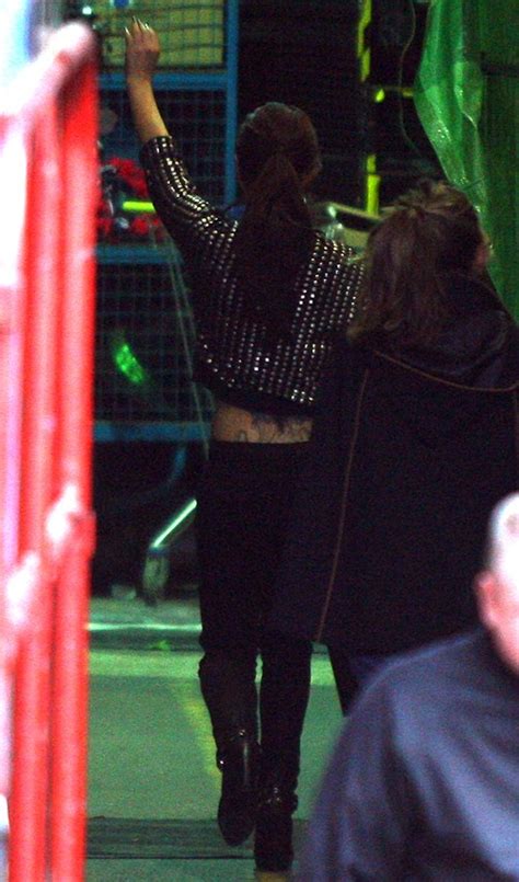 Image World Actress Cheryl Cole Showing Off Her Back Tattoo While Out
