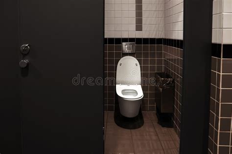 Clean Ceramic Toilet Bowl Near Tiled Wall Indoors Stock Photo Image Of Lavatory Bowl