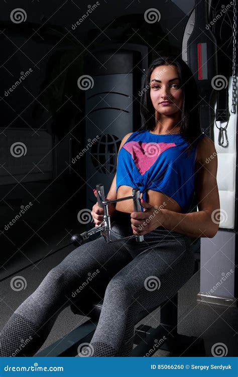 Young Girl With Sexual Inflated Figure In The Gym Doing Exercise On