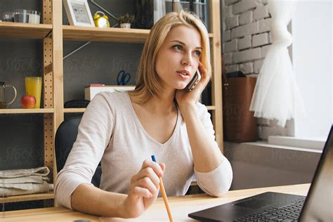 Beautiful Blonde Woman Making Phone Call At Work Del Colaborador De Stocksy Danil Nevsky