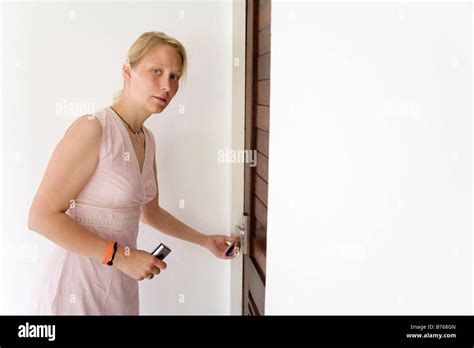Girl Closing The Door Stock Photo Alamy