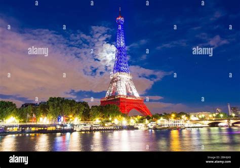 The Eiffel Tower Lit Up With The Colors Of French National Flag Stock