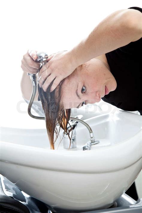 A Woman Washing Her Hair On A Sink In A Hair Salon Stock Image