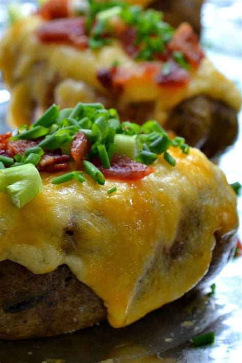 Easy loaded baked potato casserole in a glass dish over green check tablecloth. Twice Baked Potatoes | Small Town Woman