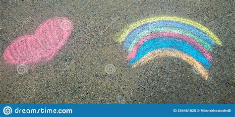 Children Paint A Rainbow On The Asphalt Selective Focus Stock Image