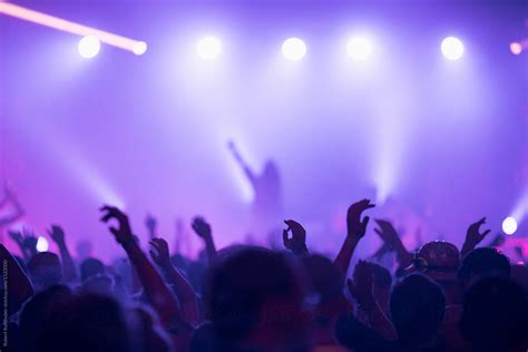 Sillhouettes Of Concert Crowd In Front Of Bright Stage Lights Del