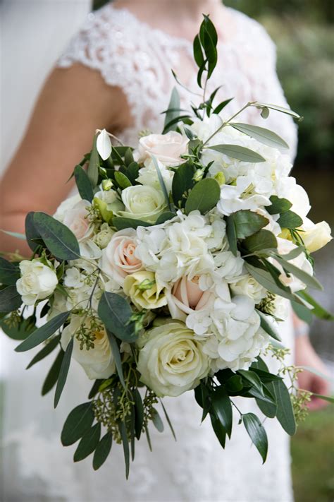 This Elegant Bridal Bouquet Was Created Using White And Blush Roses