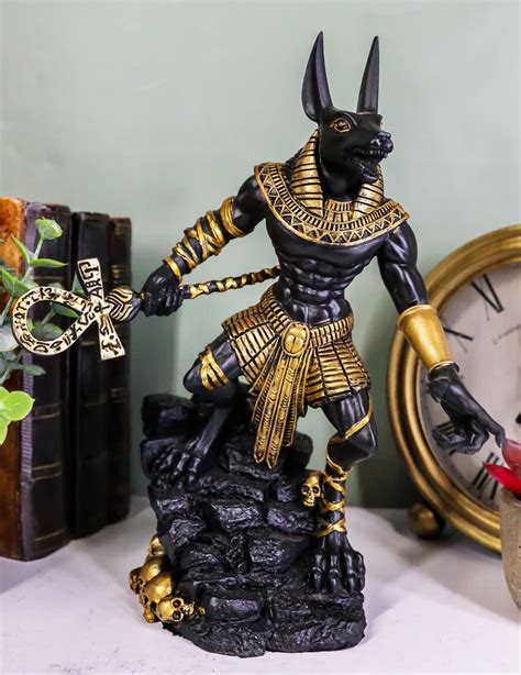 Buy Ebros Ancient Egyptian Jackal God Anubis With Ankh Staff Spear Standing On Rocky Skulls Heap