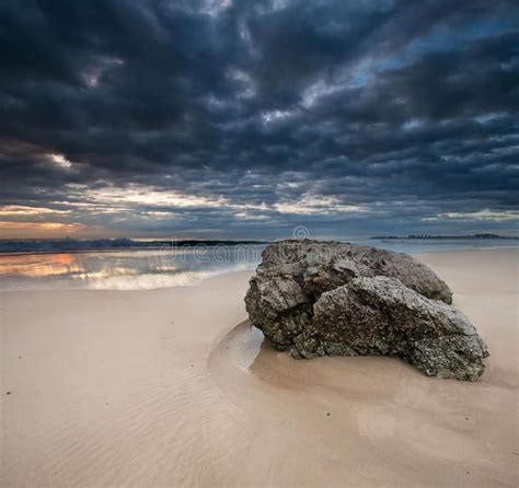 Rock On The Beach With Dramatic Sky On Square Form At Ad Dramatic
