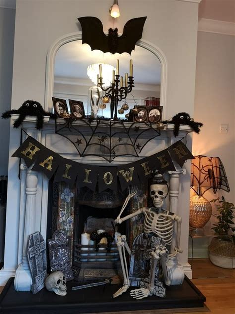 A Fireplace Decorated For Halloween With Skeleton Decorations