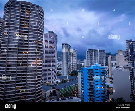 Waikiki Skyline In The Evening With Clouds Rolling In Over The