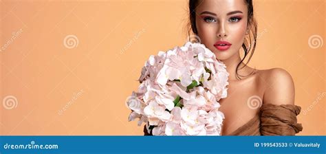 Beautiful White Girl With Flowers Stunning Brunette Girl With Big Bouquet Of Hydrangeas Stock