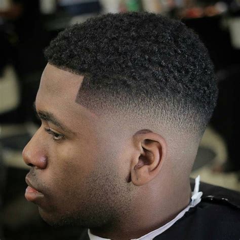 Men's short hair might be easy to control and maintain, but that doesn't mean you have to miss out in the style department. Low Fade Haircut Black Men - Wavy Haircut