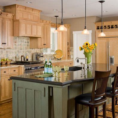 In the past, stained natural wood cabinets dominated every kitchen. Island Cabinetry shown with Lancaster door style in Maple ...
