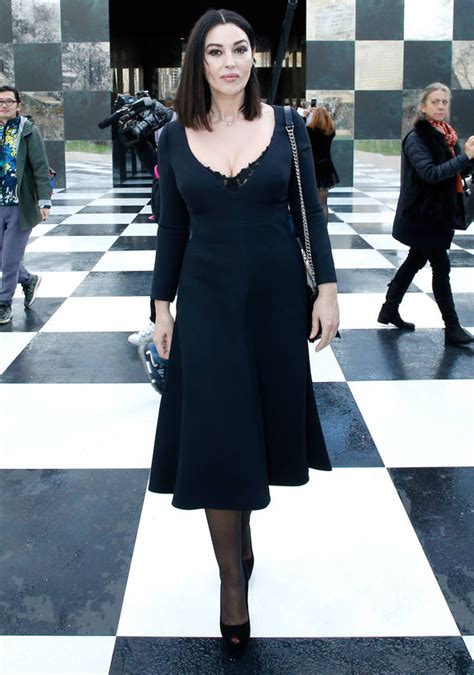 Monica Bellucci Flashes Black Lace Bra Under Busty Dress During Paris
