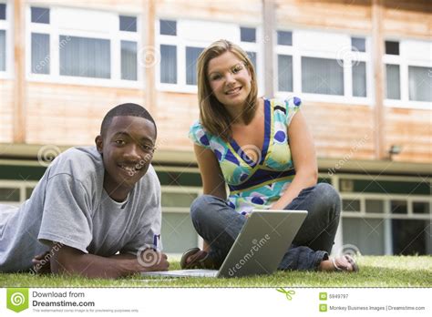 Free graphics for commercial use, no attribution required. Two College Students Using Laptop On Campus Lawn, Stock ...