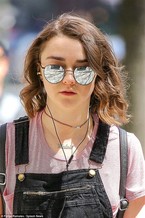 Maisie Williams Rocks Denim Overalls With Pink T Shirt And Trainers