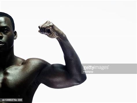 Man Flexing Biceps Photos And Premium High Res Pictures Getty Images