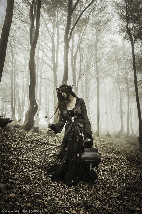 A Woman Dressed As A Victorian Era Lady In The Woods With Her Back To