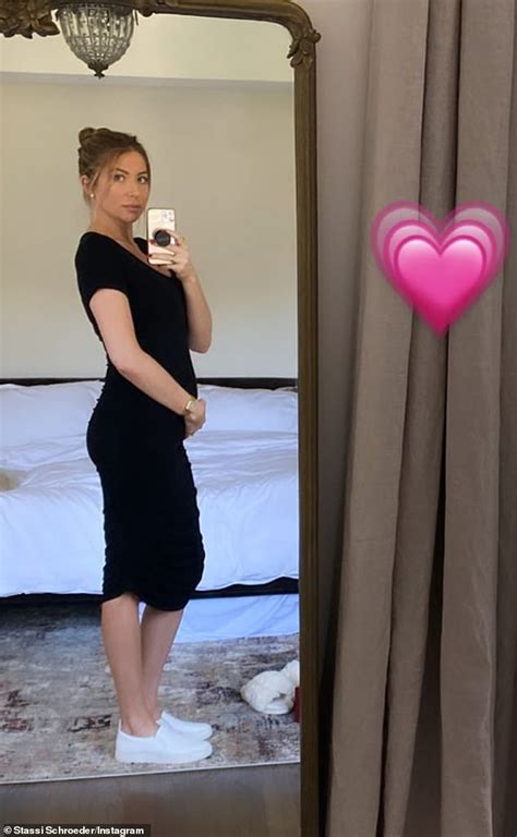 Stassi Schroeder Cradles Her Baby Bump In A Black Maxi Dress After