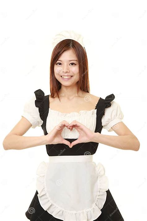 Young Japanese Woman Wearing French Maid Costume With Heart Stock Image