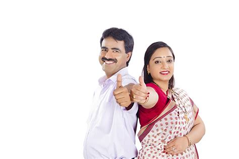 Happy Indian Couple Standing Back To Back Giving Thumbs Up Sign