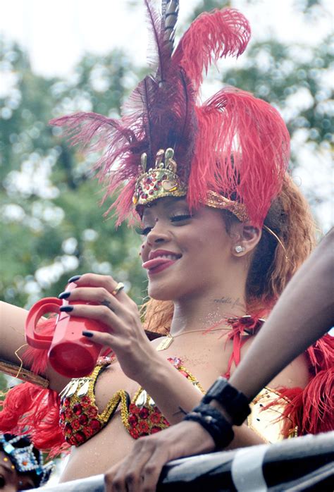 rihanna shows off her assets at the kadoomant day parade in barbados [photos]