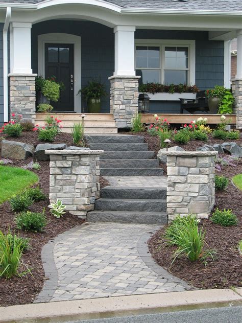 Paver Walkway Natural Stone Steps And Flanking Pillars Create A