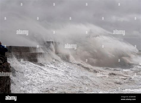 Stormy Seas Batter Porthcawl Pier And Lighthouse South Wales Uk Stock